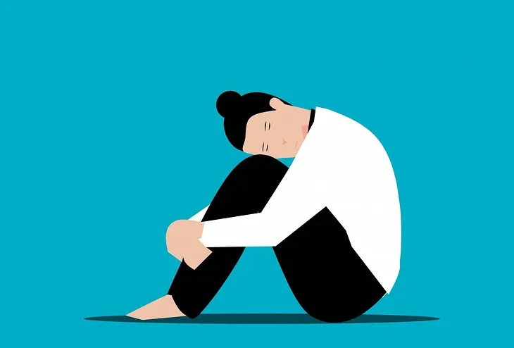 A stylised drawing of a person hunched over hugging their knees against a blue background
