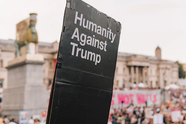 Humanity Against Trump on a poster at a rally in another country.