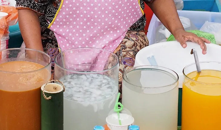 Thai drinks being sold by a street vendor.