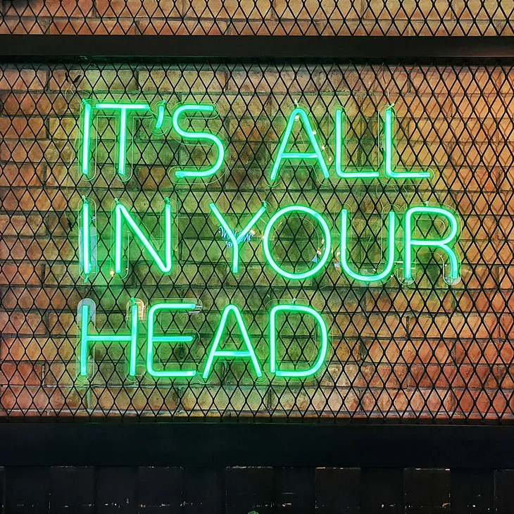 Neon sign saying ‘it’s all in your head’