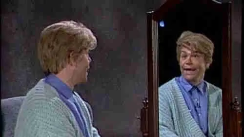 Stewart Smalley looks at himself in the mirror