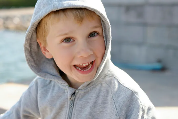 A kid wearing a hoodie