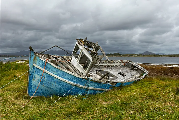 A beached, decaying boat