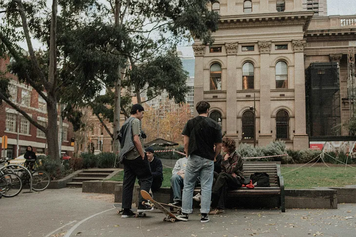 Teenage boys outside a building