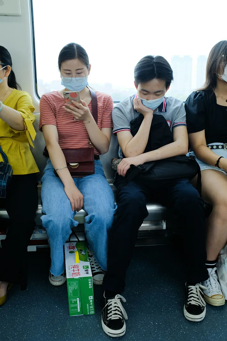 Passengers in public transport, wearing masks