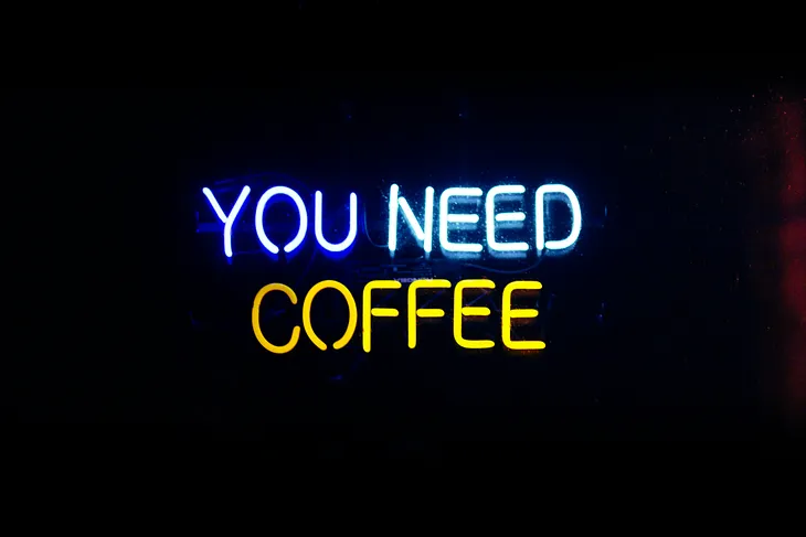 Neon sign that reads “You Need Coffee”