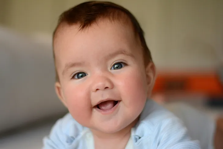 How do Babies Learn to Smile?