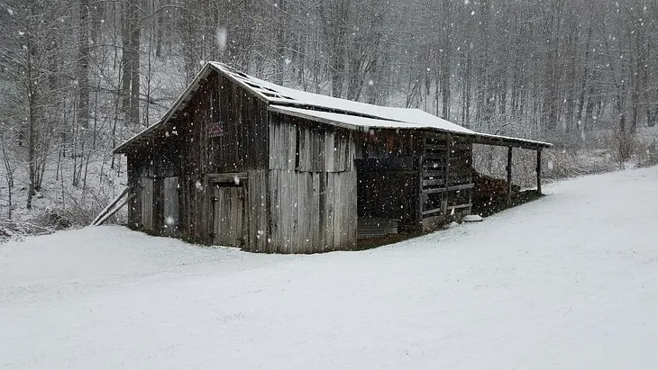an old cabin in the snow