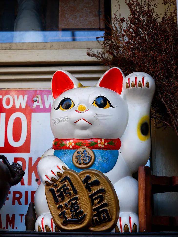 Unveiling the Secrets of Maneki Neko: The Japanese Cat That Brings Fortune!