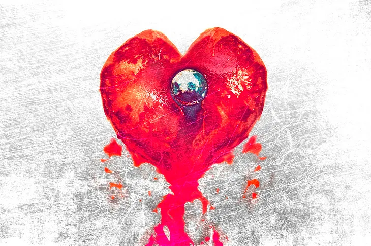 Image shows a greyish white background with a red heart in the middle, and the ink seems to run down from it, like blood.