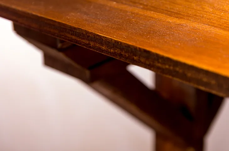 corner of brown desk top