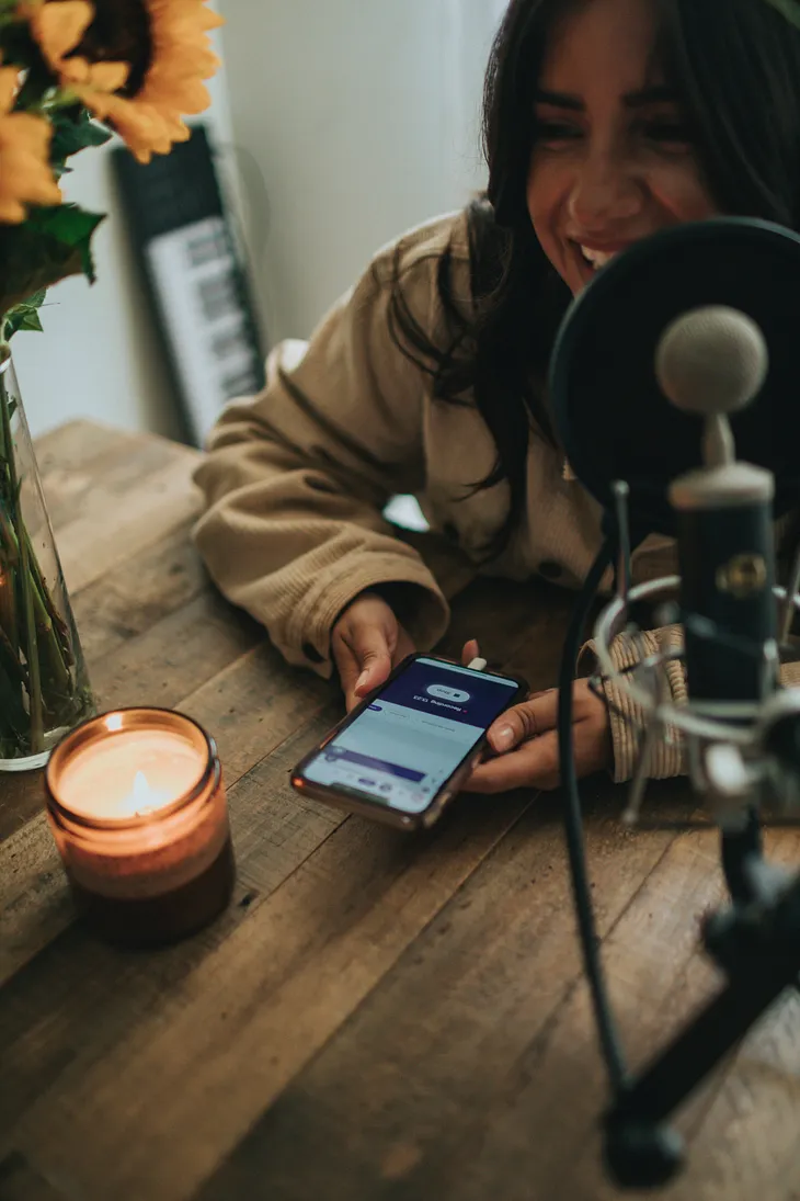 Image of a user giving Order to her voice assistant in phone