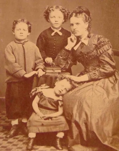 A Victorian family photo. One of the children is deseased