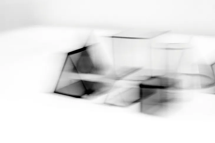 A blurry image of cubes on a table