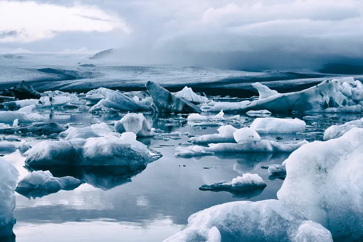 glacier, melting, water, grey sky