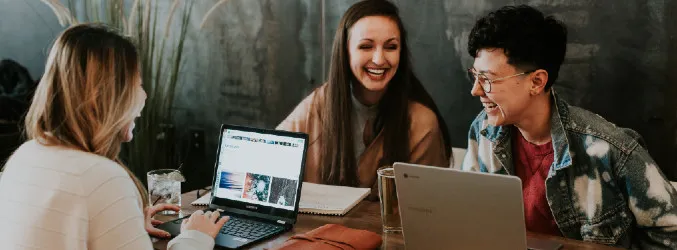 Joyous people with their laptops