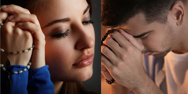 Man and woman praying rosary