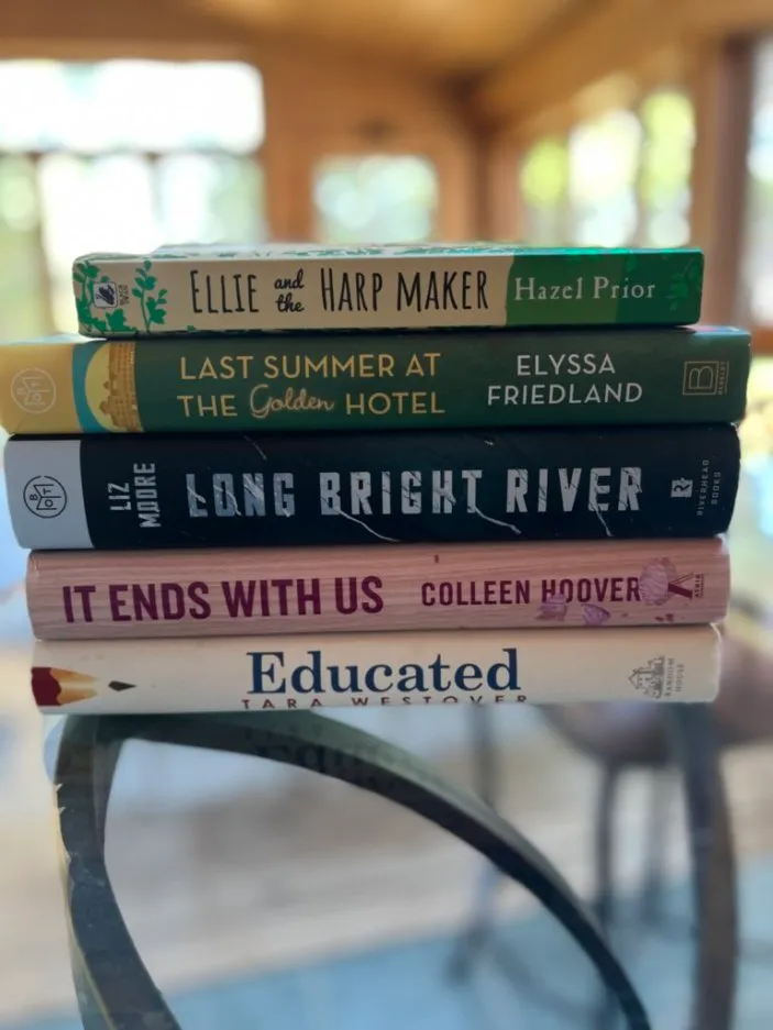 A stack of books. Spell your name with book titles. Photo by Ellie Jacobson.