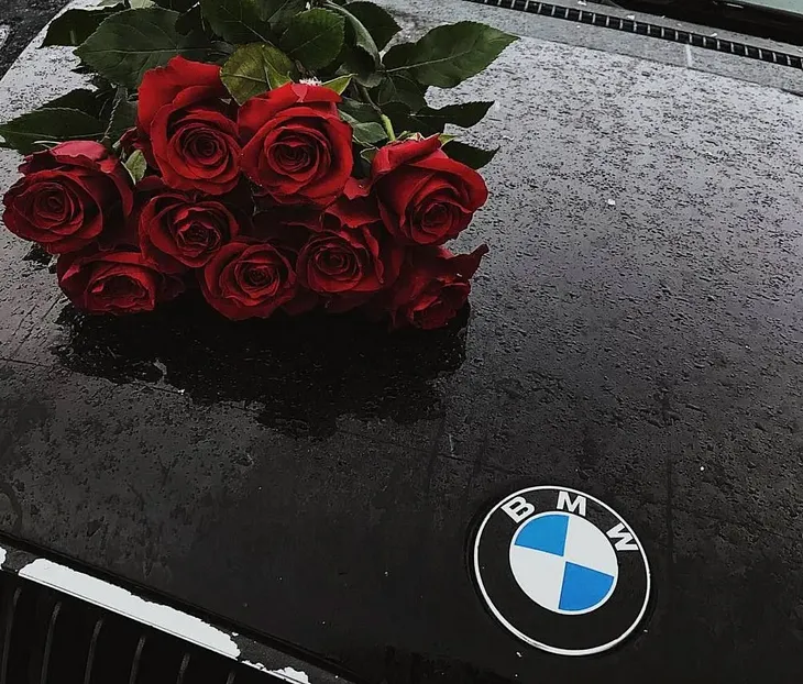 The BMW With Roses in the Backseat