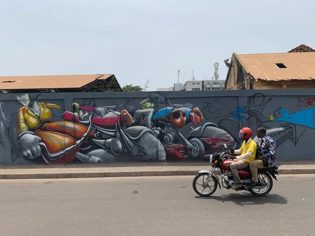 a man on a bike (a zemidjan) in Cotonou