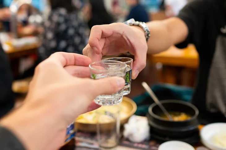 People drinking soju