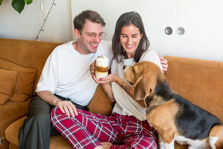white heternormative couple and their dog