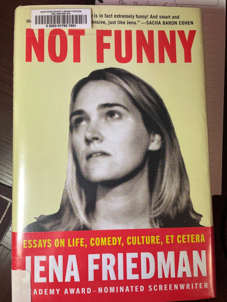 book cover of Not Funny consisting of a serious expression on the face of author Jena Friedman