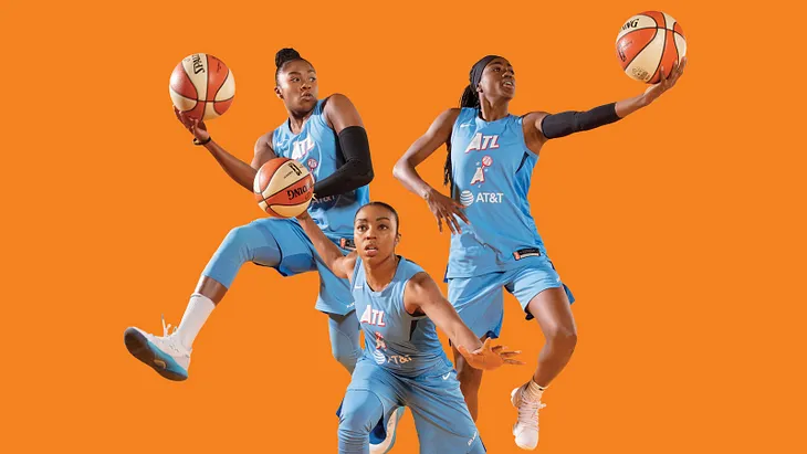 Atlanta Dream stars Alex Bentley, Renee Montgomery, and Tiffany Hayes pose for a marketing photo.