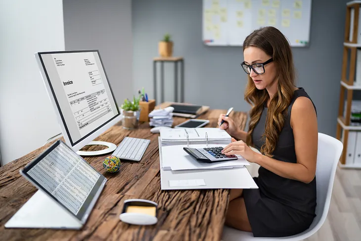 The Performer’s Schedule: A woman working at her desk.