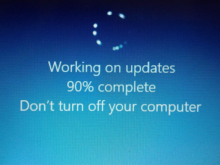 Computer screen showing the words, “Working on updates. 90% complete. Don’t turn off your computer.