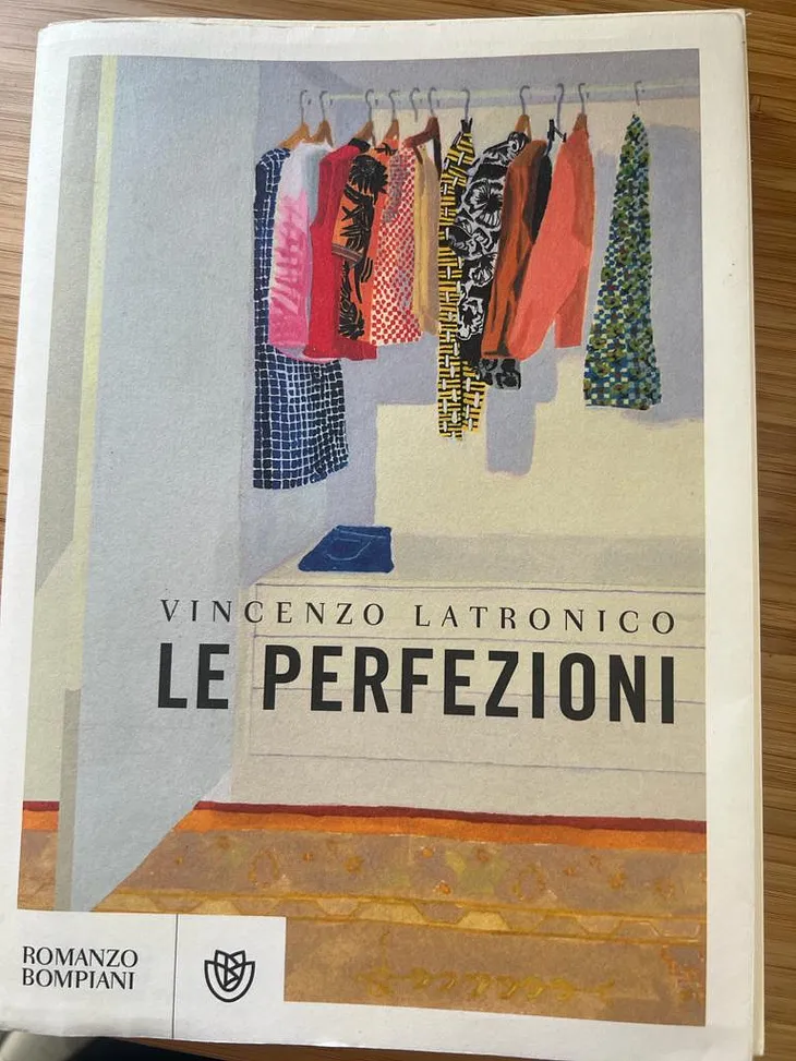 cover of the Italian-language edition of the novelLe Perfezioni by Vincenzo Latronico, depicting a painting of the interior of a closet with colourful clothes on hangers