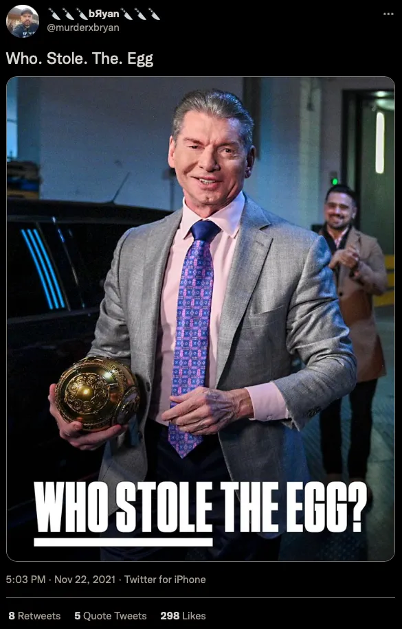 Bryan writes: “Who. Stole. The. Egg.” as Vince McMahon smiles, holding a large golden egg.