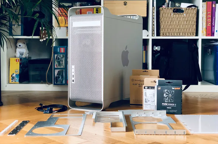 An Apple PowerMac G5 surrounded by modding components