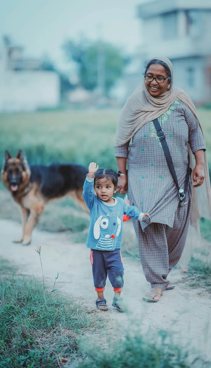 Grandmother walking with his grandson