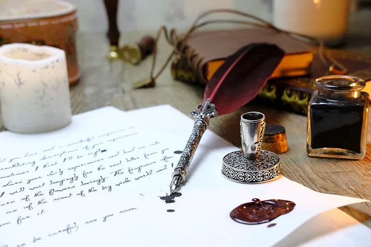 Writing with a quill and ink