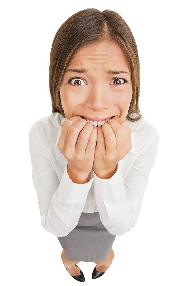 Nervous businesswoman bites her nails nervous about giving a speech