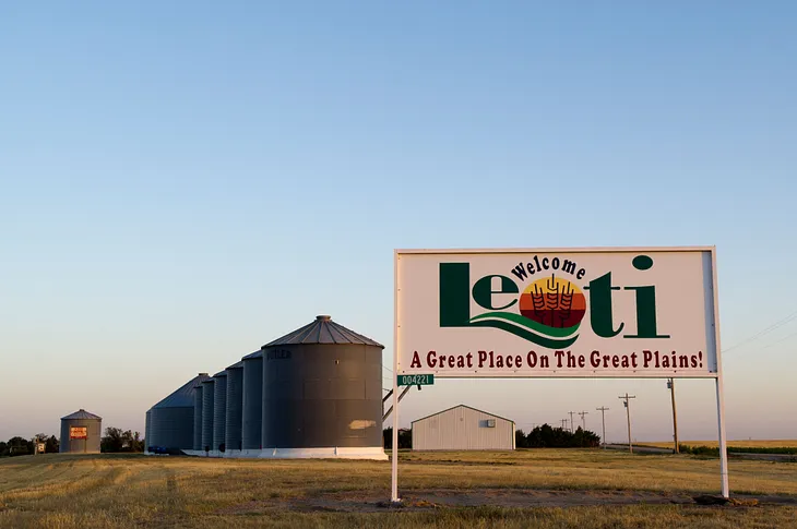 Color photo of a Welcome to Leoti sign at the edge of town