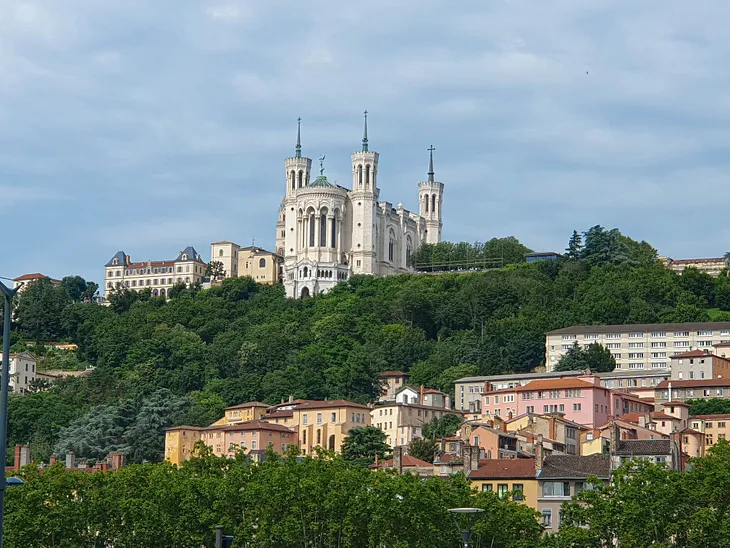 View of Lyon’s Notre Dame and rolling hills from afar
