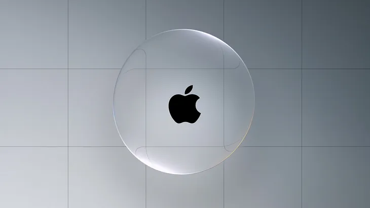 A transparent, floating liquid-glass sphere with the black Apple logo in the centre, set against a grey tiled background. The sphere subtly bends light around its edges.