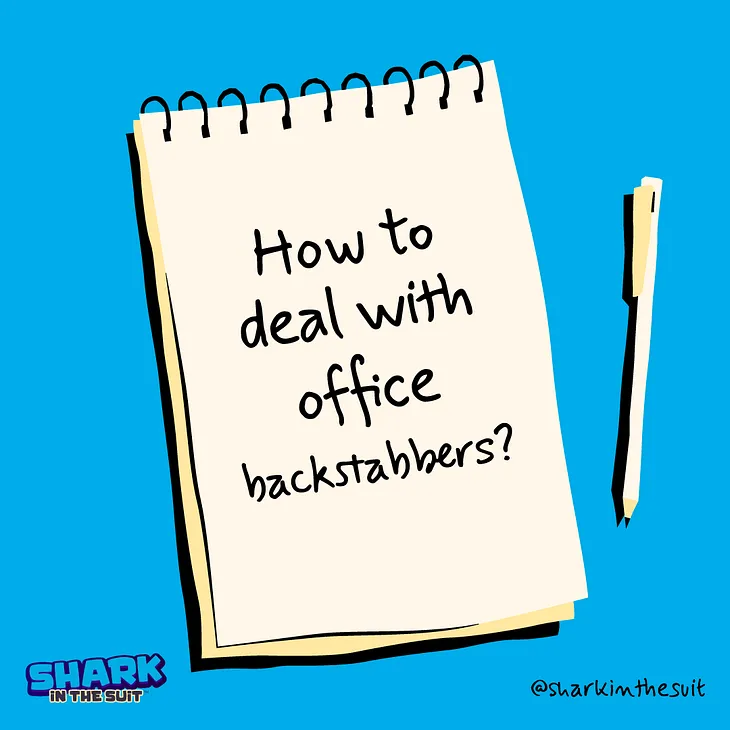 A image designed by the author (Shark in the Suit) of a notepad and pen. The notepad has a message; “How To Deal With Office Backstabbers?”