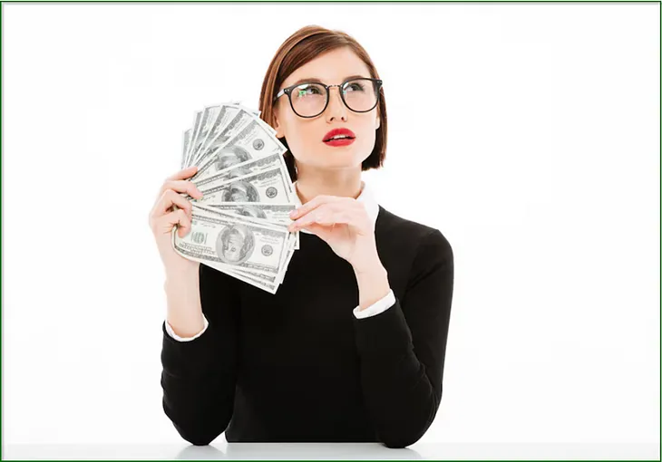 A photo of a young woman with a questioning look on her face holding a fan of hundred dollar bills.