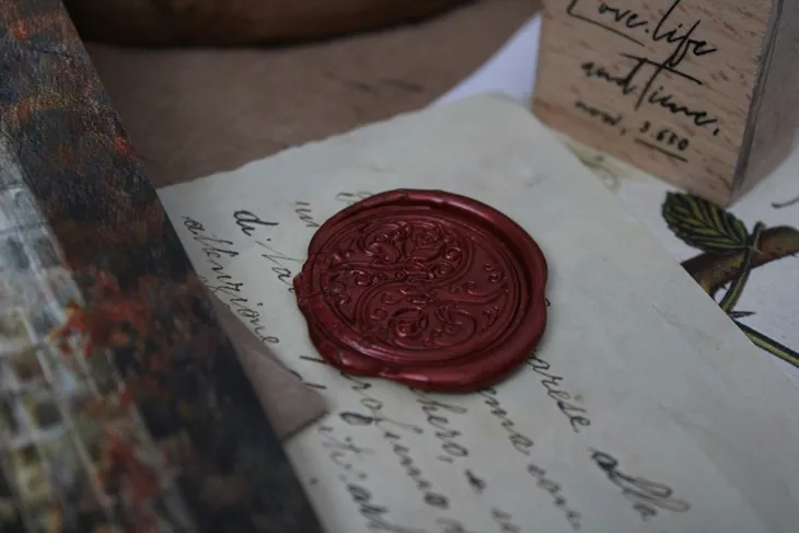 Red wax seal on an old letter.