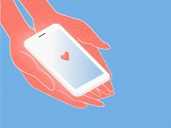 An illustration of hands holding a phone. The phone has a heart displayed on the screen indicating love