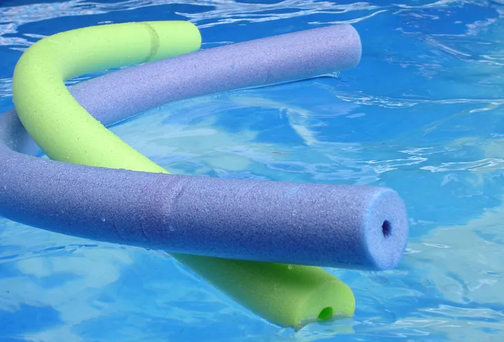 Pool noodles in a swimming pool