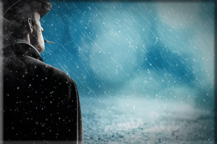 A man wearing a hat and smoking a cigarette, standing in the rain.