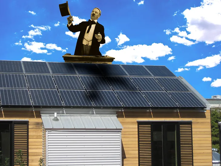 An image of a modest house with rooftop solar. Rising over the roof is a picture of WC Fields as a carny barker, waving his hat around and shouting. Image: Future Atlas/www.futureatlas.com/blog (modified) https://www.flickr.com/photos/87913776@N00/3996366952 CC BY 2.0 https://creativecommons.org/licenses/by/2.0/ — J Doll (modified) https://commons.wikimedia.org/wiki/File:Blue_Sky_%28140451293%29.jpeg CC BY 3.0 https://creativecommons.org/licenses/by/3.0/deed.en