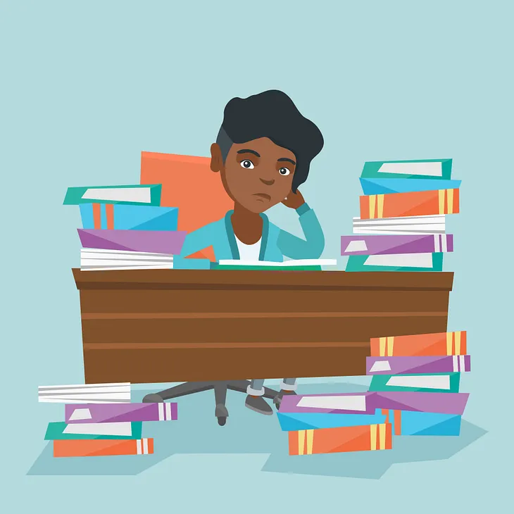 African American annoyed student sitting at the table with propped head and many books.