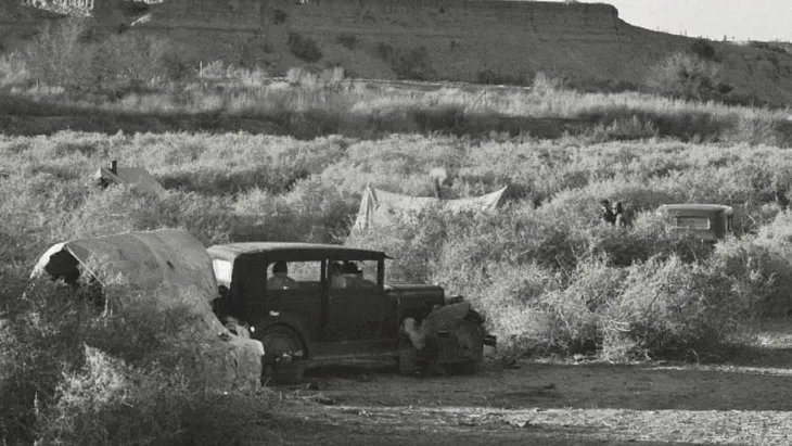 An old-fashioned car in the California desert. Black-and-white photo. Image from Tess Taylor’s poetry book Last West.