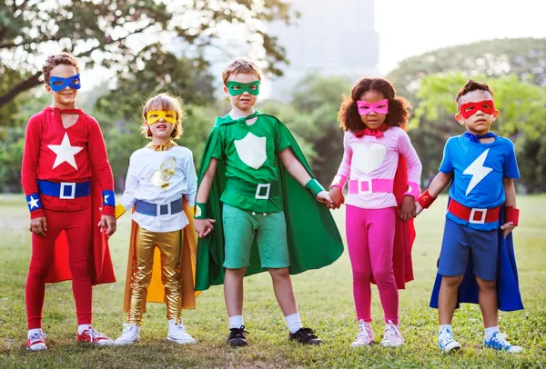 Five children of all races dressed as superheroes