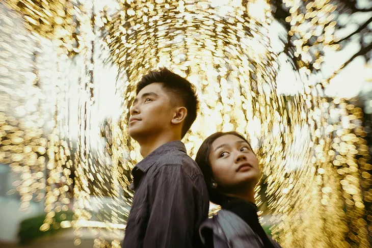 A Filipino woman standing with her boyfriend.